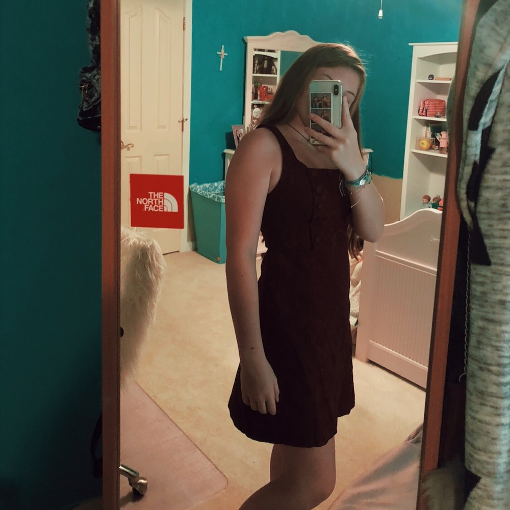 This is a super cute burgundy dress with buttons